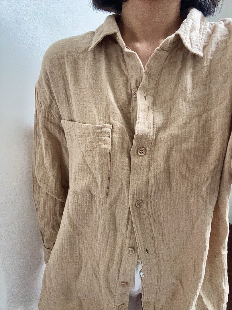 Cotton On Oversized Beige Cotton Blend Button-Up Shirt (Category: Longsleeves) located in Bulacan. Submitted by _arislmt (Listing ID 1464586162, Image 1). Description: - Comfortable oversized fit - Chest pocket - Button-up front - Ideal for casual wear - Versatile styling options - Loose and relaxed vibe - Best fits M-L .