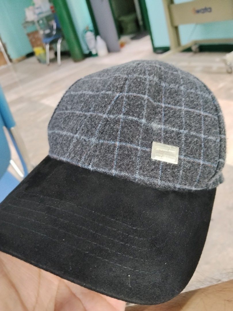 Oxgn Plaid Grey Black Cap Hat One Size (Category: Caps & Hats) located in Makati City. Submitted by acunamagbenta (Listing ID 1464753358, Image 1). Description: - Brand: Oxgn - Design: Grey crown with blue and white plaid pattern - Brim: Black suede-like material with a front metal logo plate - Fit: Adjustable strap closure (One size fits all) - Care Instructions: Hand wash only - Origin: Made in China.
