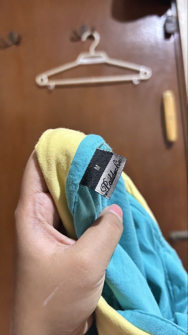 Paddock's Blue and Yellow Polo Shirt (Category: Shirts) located in Cabuyao City. Submitted by pickedbyarya (Listing ID 1464749251, Image 2). Description: Size M W 14 x 23.5 in Di super nasuot Maganda tela - Brand: Paddock - Size: Medium - Color: Blue with bright yellow collar and sleeve trim - Material: Cotton, relaxed everyday fit - Details: 3-button placket, small embroidered logo on chest.