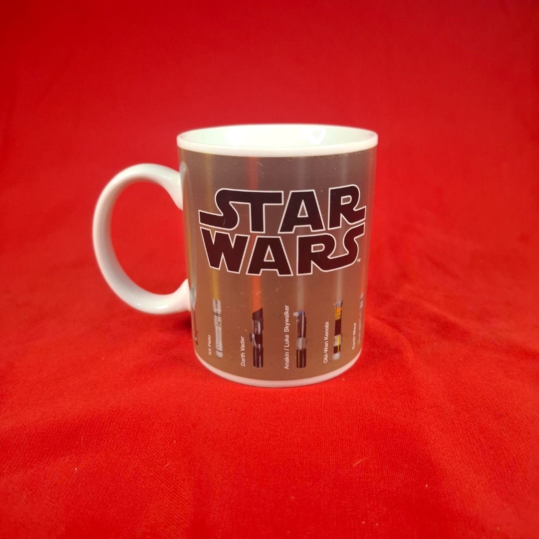 Paladone Star Wars Lightsabers color changing Ceramic Mug (Category: Western Merchandise) located in Mandaluyong City. Submitted by edward123_andren (Listing ID 1464709025, Image 1). Description: - Official Star Wars merchandise by Paladone - Features iconic lightsaber illustrations and classic logo wrap-around design - Standard ceramic coffee mug with white interior and handle - Official licensed stamp on the bottom base - Hand wash recommended 