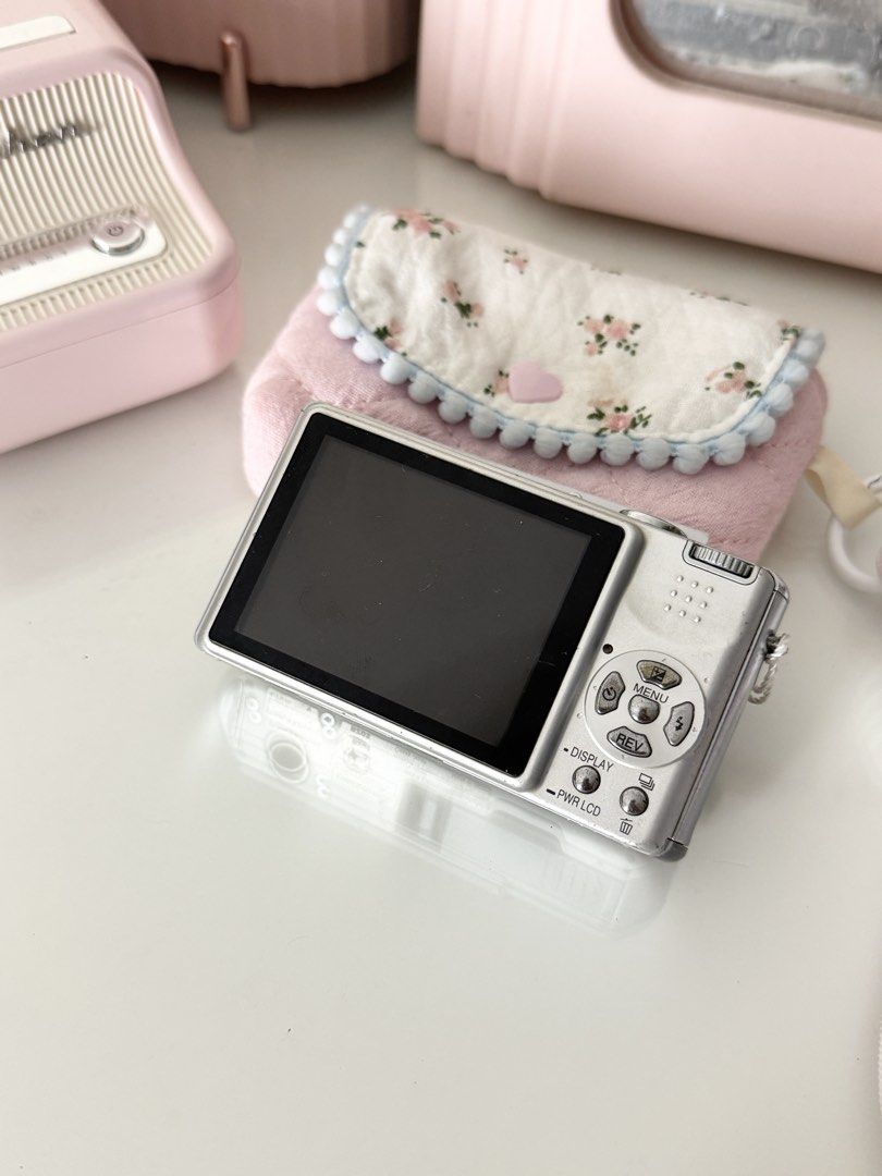Panasonic Lumix DMC-DX7 Silver Digital Camera Digicam (Category: Cameras) located in Marilao. Submitted by toutlemonde (Listing ID 1464752814, Image 2). Description: - 5MP CCD sensor - 3x optical zoom - can take photos/ videos - 8/10 cosmetic condition - uses SD card (not included) Issue: shows lines on the screen sometimes, esp when shooting against a bright background/area. could be a sign of a possible sensor issue, but it currently doesn’t af