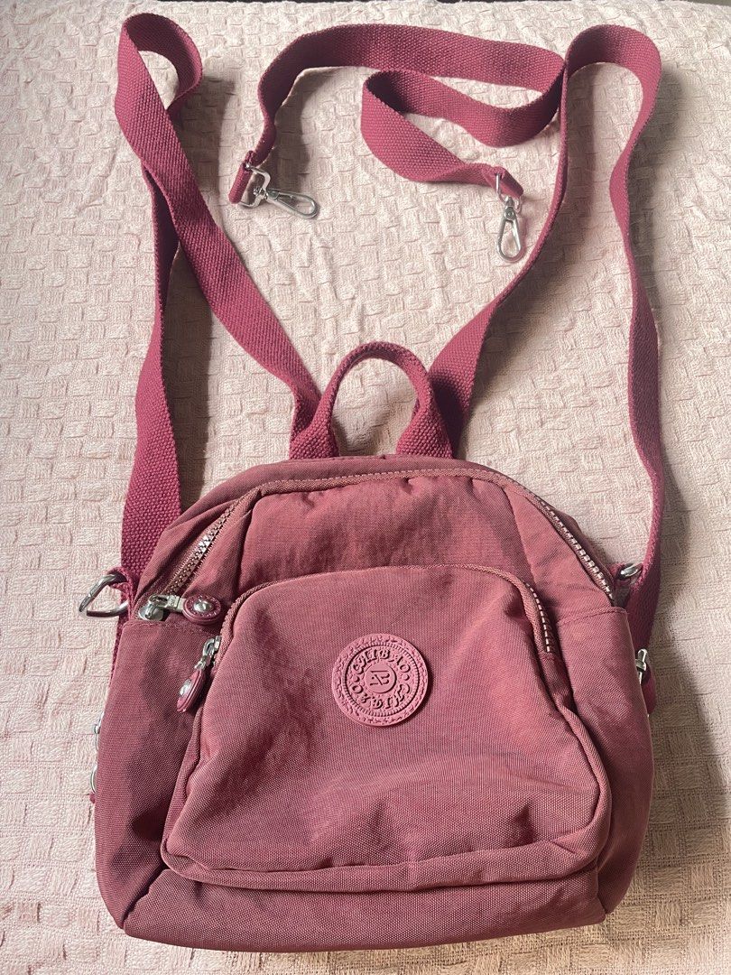 Panda Bag, Mettalic Bag, Maroon Backpack (Category: Tote Bags) located in Manila. Submitted by declutter_with_me-0__0-yana (Listing ID 1464641568, Image 3). Description: ✨BUNDLE DEAL✨ Three stylish bags for one great price! 1️⃣ BARELY USED: Cute Panda Knit Bag with a long strap for comfortable carrying. 2️⃣ Sparkly Pearl Handbag: Elegant and eye-catching, still brand new in its original packaging. 3️⃣ LIKELY USED : Maroon Nylon Backpack. Durable 