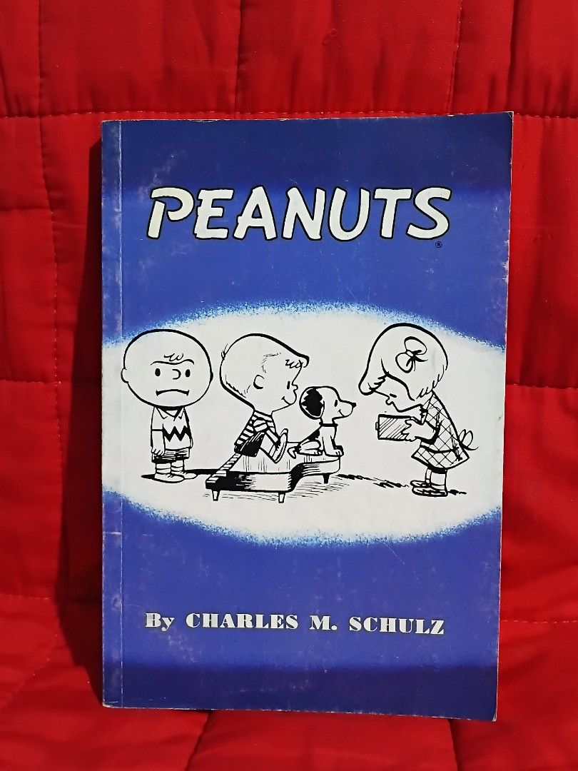 Peanuts by Charles M. Schulz Paperback Comic Book (Category: Comics & Manga) located in Manila. Submitted by krishna_ayanami (Listing ID 1464739034, Image 1). Description: - Title: Peanuts Comic Book - Publisher: Titan Comics - Format: Standard Paperback - Content: Classic black and white comic strips starring Charlie Brown, Snoopy, and the gang - Condition: Great read for fans of timeless newspaper strips.