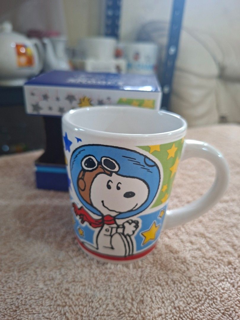 Peanuts Snoopy and Woodstock Ceramic Mug (Category: Coffee & Tea Tableware) located in Consolacion. Submitted by luxekerei (Listing ID 1464769277, Image 2). Description: - Peanuts Snoopy and Woodstock ceramic mug set box featuring an astronaut-themed design from the © 2015 Peanuts Worldwide collection..