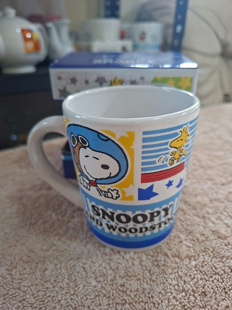 Peanuts Snoopy and Woodstock Ceramic Mug (Category: Coffee & Tea Tableware) located in Consolacion. Submitted by luxekerei (Listing ID 1464769277, Image 3). Description: - Peanuts Snoopy and Woodstock ceramic mug set box featuring an astronaut-themed design from the © 2015 Peanuts Worldwide collection..