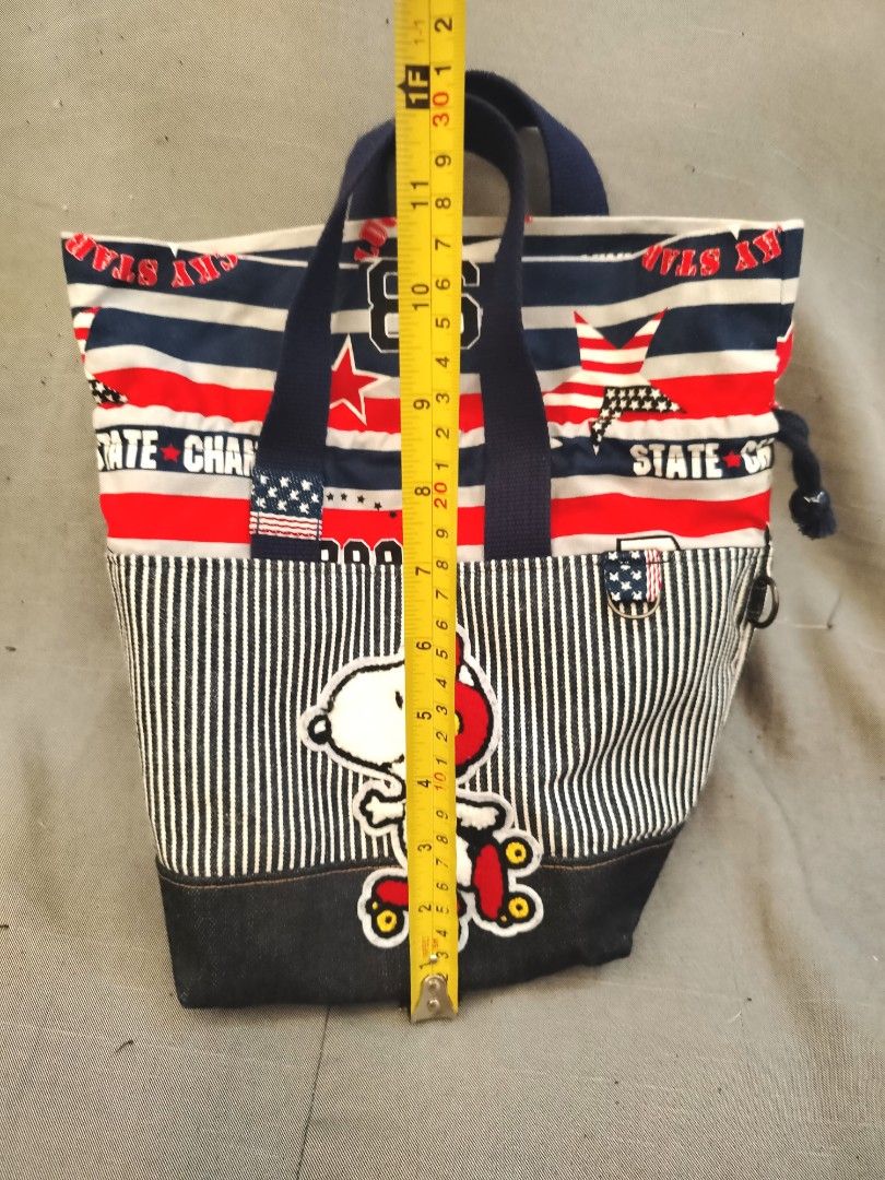 Peanuts Snoopy Blue Red Stripes Tote Bag (Category: Tote Bags) located in San Fernando. Submitted by jpmarketplace2023 (Listing ID 1464736397, Image 2). Description: 💚 All items are authentic from Japan. 💛 MOP: GCash (❌️ GCash Protect) 🩵 MOD: LBC only (❌️ S. Checkout, COD, COP) 💙 Meet-up: Vista Mall, San Fernando, Pampanga 💜 All items are on-hand. 🧡 First to pay gets the item first. ❤️ Breakable items are packed with care and caution. Selle