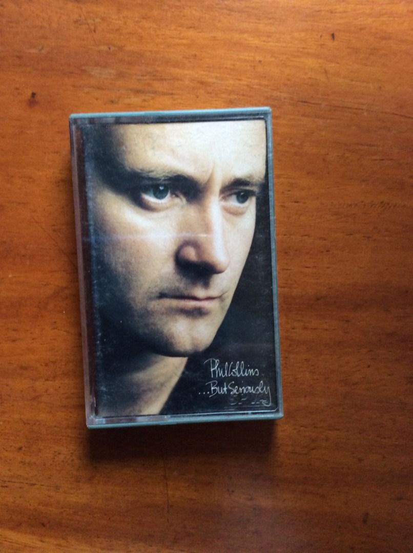 Phil Collins ...But Seriously Cassette Tape (Category: CDs & DVDs) located in Silang. Submitted by lawrencenorthey (Listing ID 1464580263, Image 1). Description: - Phil Collins cassette album: '...But Seriously' - Released by WEA Singapore - Features hit songs like 'Another Day in Paradise' and 'I Wish It Would Rain Down' - A must-have for any Phil Collins fan.