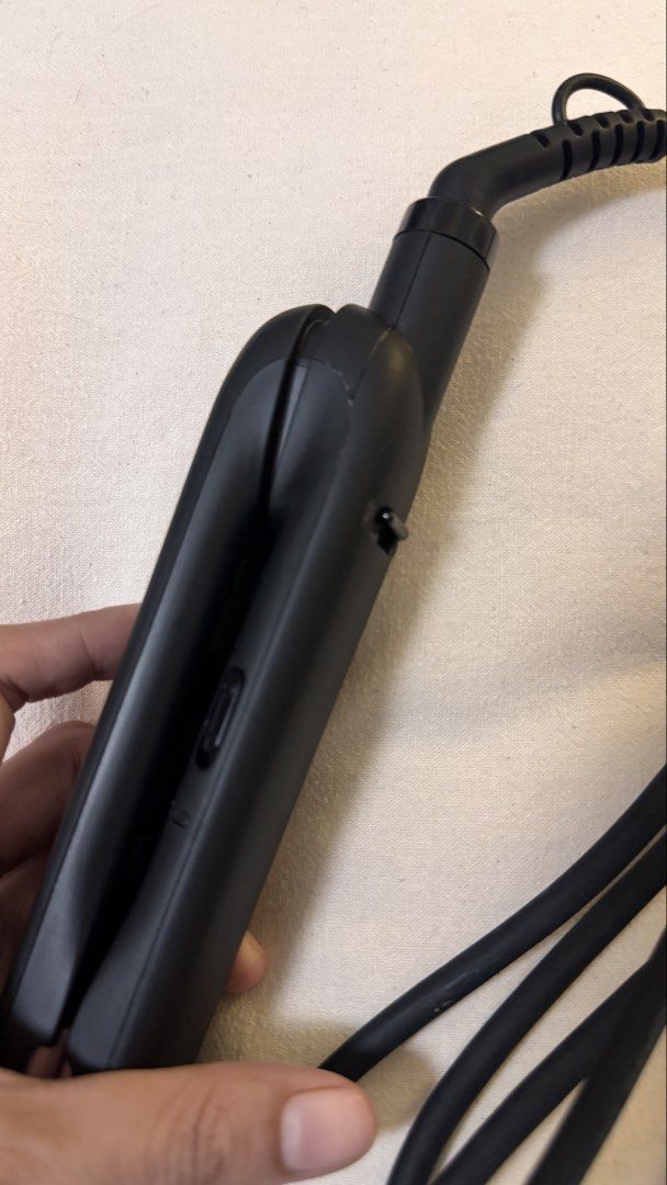 Philips Essential Hair Straightener (Category: Hair) located in Taguig. Submitted by siyelamaree (Listing ID 1464738710, Image 2). Description: Philips Essential Hair Straightener in sleek black. Heats up super fast within 60 seconds. Tourmaline ceramic plates leave hair shiny and frizz-free. Slim design makes styling easy and quick. Long cord with standard two-pin plug. Works great, gets hot quickly. Handy tool for daily styling routines. - can 