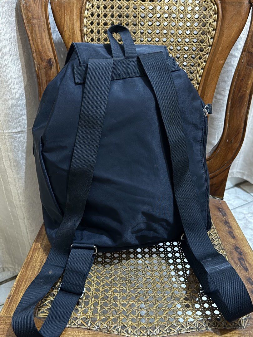 Pierre Cardin Japan Black Nylon Backpack with Front Pockets (Category: Backpacks) located in Valenzuela. Submitted by missp22 (Listing ID 1464734370, Image 3). Description: - Brand: Pierre Cardin - Material: Durable black nylon - Closure: Flap with textured strap, metal logo plate, and secure drawstring main compartment - Pockets: Two large front pockets with button flaps - Straps: Adjustable black shoulder straps for custom comfort - Condition: 