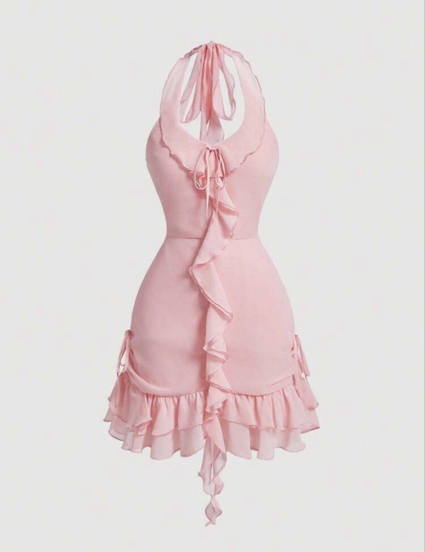 Pink Halter Ruffle Mini Dress (Category: Dresses) located in Manila. Submitted by paragon.attic (Listing ID 1464748679, Image 1). Description: Havent worn this, bought the wrong size - Color: Light pink - Style: Halter neck with cascading ruffles down the center and hem - Fit: Fitted waist with flowing chiffon-like fabric - Adjustability: Adjustable neck ties and side drawstring details - Occasion: Perfect for dates, parties, or special events.