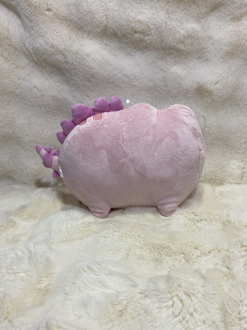 Pink Pusheen cat/dino plush (Category: Plushies & Soft Toys) located in Kalibo. Submitted by ollie_stuffshop (Listing ID 1464579467, Image 2). Description: 20cm x 29cm Before you send your inquiries: ❗️Last Price is already posted ❗️Manage your expectations, WYSIWYG ❗️May need washing ❗️Dropoff is every Wednesday & Sunday.
