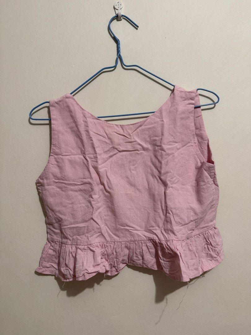 Pink Ruffled Hem Crop Top (Category: Sleeveless) located in San Fernando. Submitted by richeloy (Listing ID 1464572345, Image 1). Description: - Cute pink crop top - Ruffled hem detail - Sleeveless design - Versatile for casual wear or dressing up - Pairs well with shorts or skirts - A sweet addition to your wardrobe.