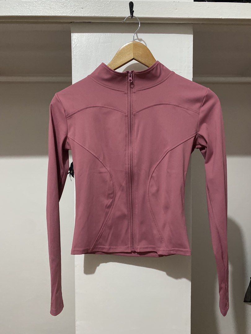 Pink Zip-Up Activewear Jacket (Category: Coats, Jackets and Outerwear) located in Manila. Submitted by zapitup (Listing ID 1464570913, Image 1). Description: - Dusty rose long-sleeved zip-up jacket - High neckline with full zipper - Fitted silhouette with curved seam details - Comfortable and stretchy material - Ideal for workouts or casual wear.