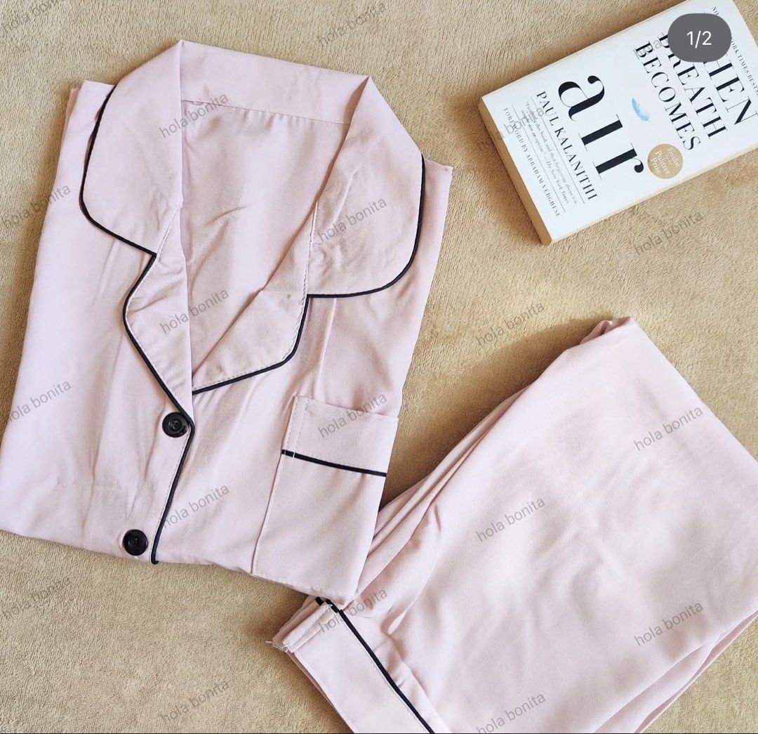 Plain Pink Sleepwear Set (Category: Undergarments & Loungewear) located in Manila. Submitted by chavirly (Listing ID 1464712959, Image 1). Description: - Color: Soft pink with stylish contrast black piping - Design: Short-sleeve top with dark buttons and a chest pocket, paired with relaxed-fit matching pants - Fabric: Soft chiffon like lightweight fabric - Fit: Comfortable and relaxed for ultimate lounging - Condition: Brand new, clean, and neatl