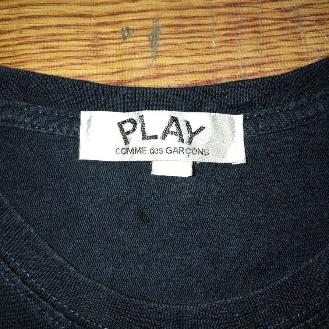 Play CdG Tee Navy Blue (Category: Luxury Apparel) located in Dasmarinas. Submitted by cornyxmessy (Listing ID 1464592207, Image 2). Description: width - 19 length - 24.5.