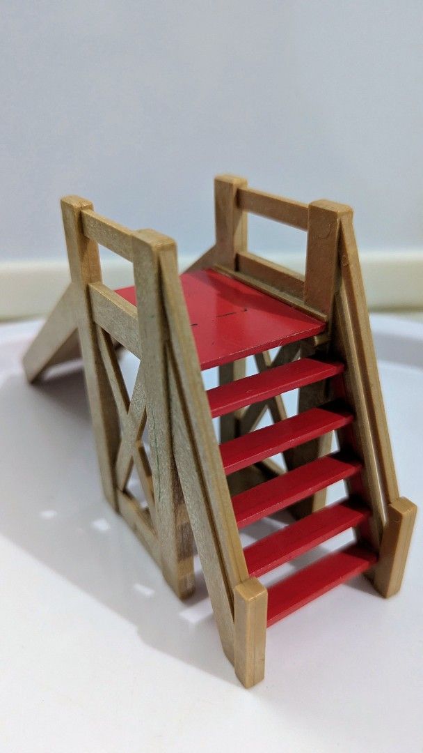 Playground Slide (Category: Kids Toys) located in Quezon City. Submitted by furbous (Listing ID 1464717098, Image 3). Description: - Charming wooden toy playground set - Includes a red slide, staircase, tower platform - Shows minor scuffs and paint wear on the red slide from regular play - Great addition to any dollhouse collection doll not included same material as Sylvanian families .