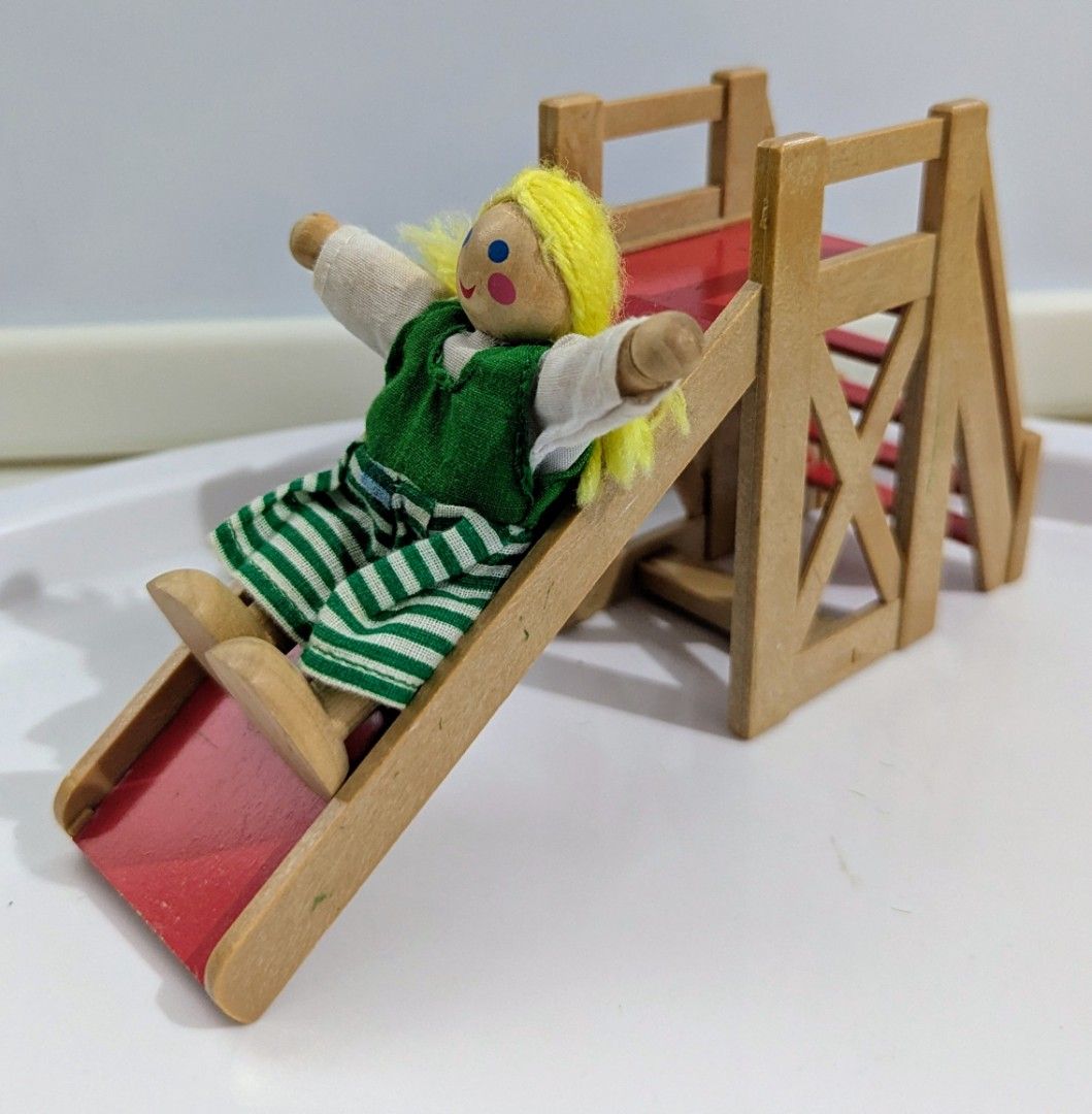 Playground Slide (Category: Kids Toys) located in Quezon City. Submitted by furbous (Listing ID 1464717098, Image 2). Description: - Charming wooden toy playground set - Includes a red slide, staircase, tower platform - Shows minor scuffs and paint wear on the red slide from regular play - Great addition to any dollhouse collection doll not included same material as Sylvanian families .