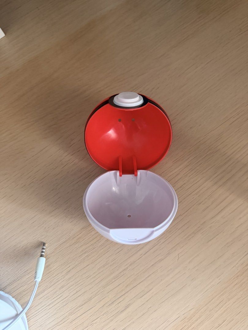 Pokemon Pokeball Case (Category: Kids Toys) located in Manila. Submitted by ellede32655 (Listing ID 1464619350, Image 1). Description: - Adorable Pokeball design - Perfect for storing small items like earphones, coins, or accessories - Features an earphone jack opening for convenience - A must-have for any Pokemon fan or collector - Shows some signs of wear but remains fully functional.