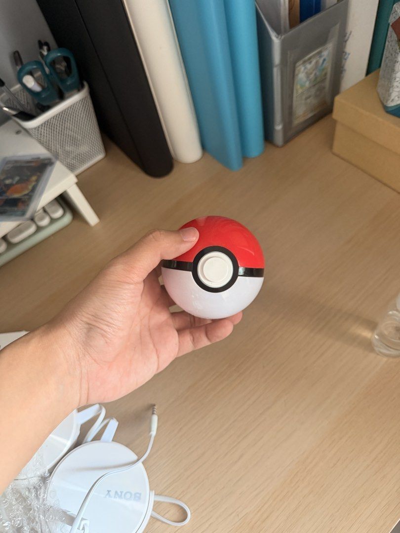 Pokemon Pokeball Case (Category: Kids Toys) located in Manila. Submitted by ellede32655 (Listing ID 1464619350, Image 2). Description: - Adorable Pokeball design - Perfect for storing small items like earphones, coins, or accessories - Features an earphone jack opening for convenience - A must-have for any Pokemon fan or collector - Shows some signs of wear but remains fully functional.