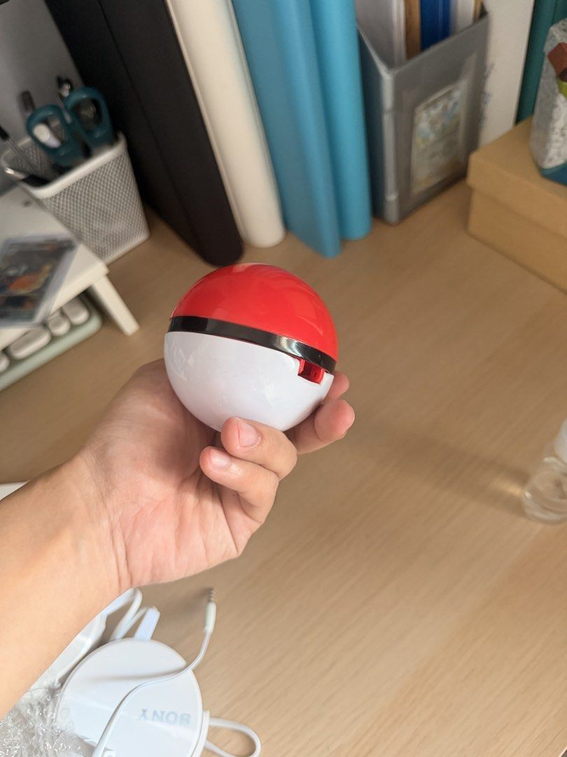 Pokemon Pokeball Case (Category: Kids Toys) located in Manila. Submitted by ellede32655 (Listing ID 1464619350, Image 3). Description: - Adorable Pokeball design - Perfect for storing small items like earphones, coins, or accessories - Features an earphone jack opening for convenience - A must-have for any Pokemon fan or collector - Shows some signs of wear but remains fully functional.