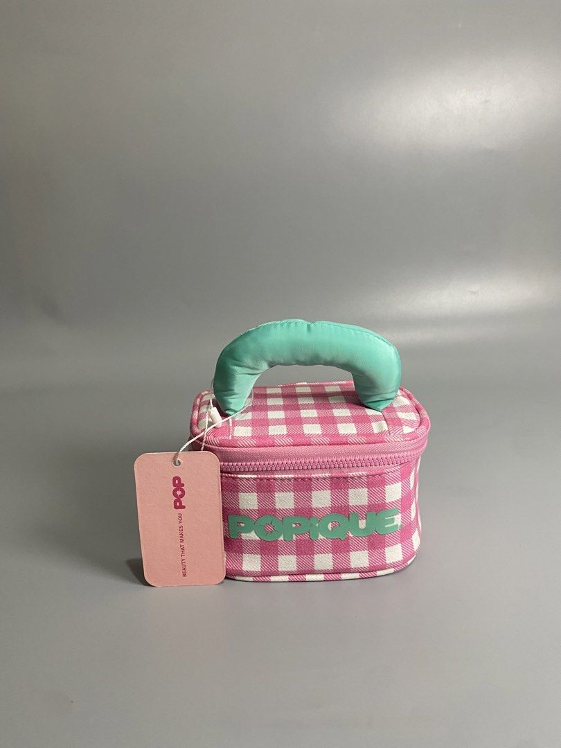 POPIQUE Pink Gingham Makeup Vanity Bag with Mirror (Category: Purses & Pouches) located in Davao. Submitted by brandedthrift.134 (Listing ID 1464736491, Image 1). Description: - Brand: POPIQUE (Brand New with Tags) - Design: Pink & white gingham pattern with teal puffy handle and matching front text - Interior: Pink lining with built-in mirror inside the lid - Closure: Zip-around closure - Packaging: Packed in a clear plastic storage bag.