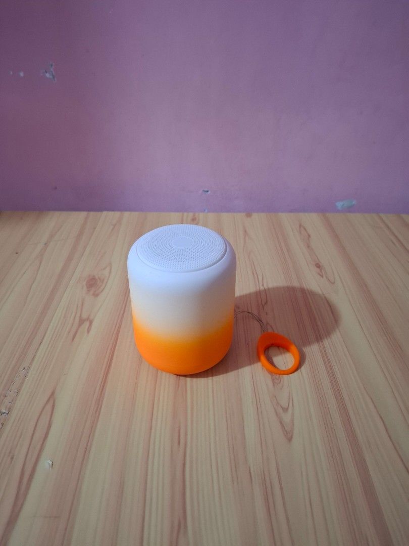 Portable Bluetooth Speaker with Orange Loop (Category: Soundbars, Speakers & Amplifiers) located in Siniloan. Submitted by mari_881709 (Listing ID 1464620465, Image 1). Description: - White and orange gradient portable speaker - Handy orange loop for easy carrying - Perfect for music on the go - Wireless connectivity - Compact and travel-friendly design.