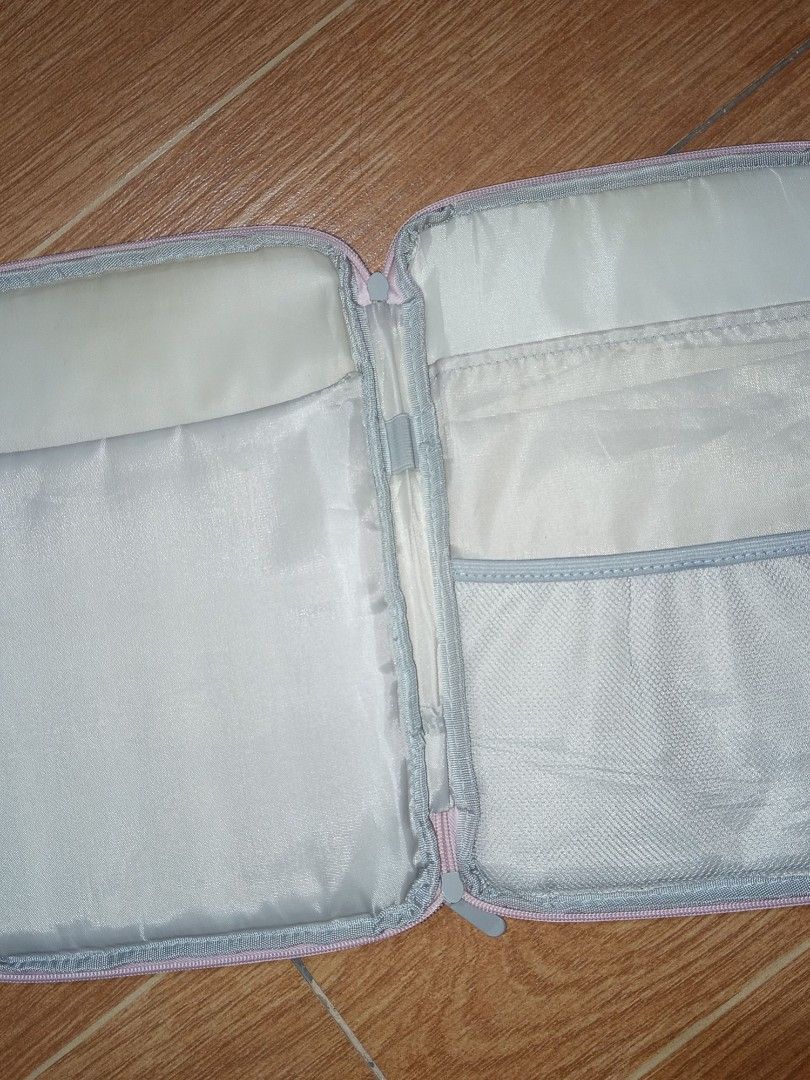 Portable Tablet Bag - Pink (Category: Purses & Pouches) located in Manila. Submitted by aymasaya (Listing ID 1464636459, Image 2). Description: - Chic light pink zippered pouch - Features multiple internal compartments for organization - Ideal for storing small items, travel essentials, or tech accessories - Smooth and reliable zipper closure - Includes a small, convenient loop handle - need wash orig price: 200+ RFS: not using anymore kasi mas l