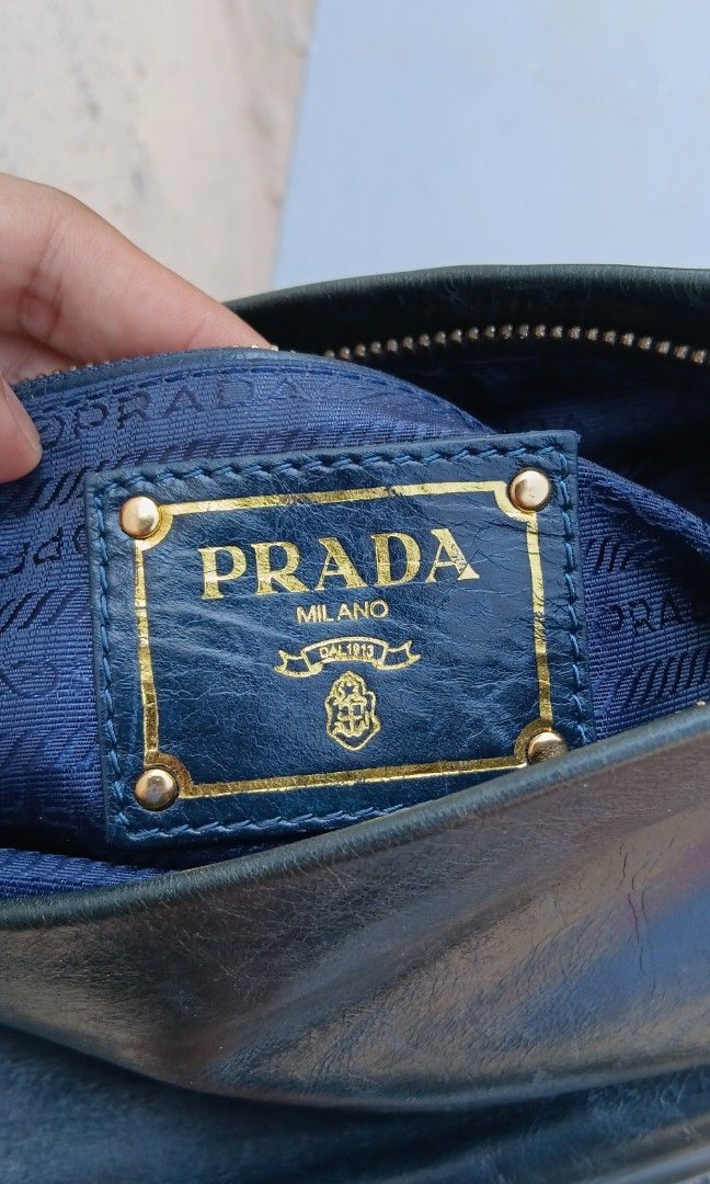 PRADA (Category: Cross-body Bags) located in Legazpi City. Submitted by nashaiza (Listing ID 1464624709, Image 3). Description: Prada color: Dark Green made in italy code: 175 lampo under zipper replace strap sign of usage Japan source *authenticity not guarantee MOP: GCash Courier: J&T Express.