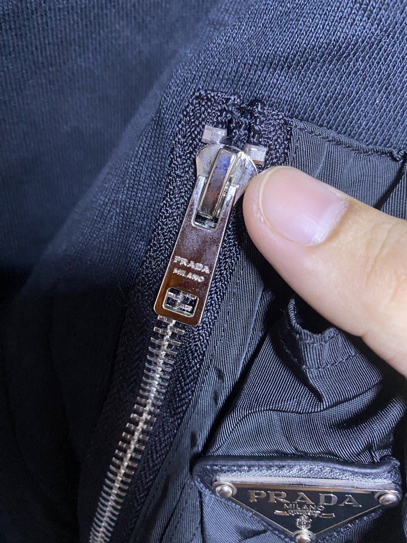 Prada (Category: Luxury Apparel) located in Iloilo. Submitted by prelovedfindsilo (Listing ID 1464674762, Image 3). Description: PR@DA COTTON FLEECE AND RE-NYLON HOODIE 22 inches width 26.5 inches length Like new condition Cut washtag .
