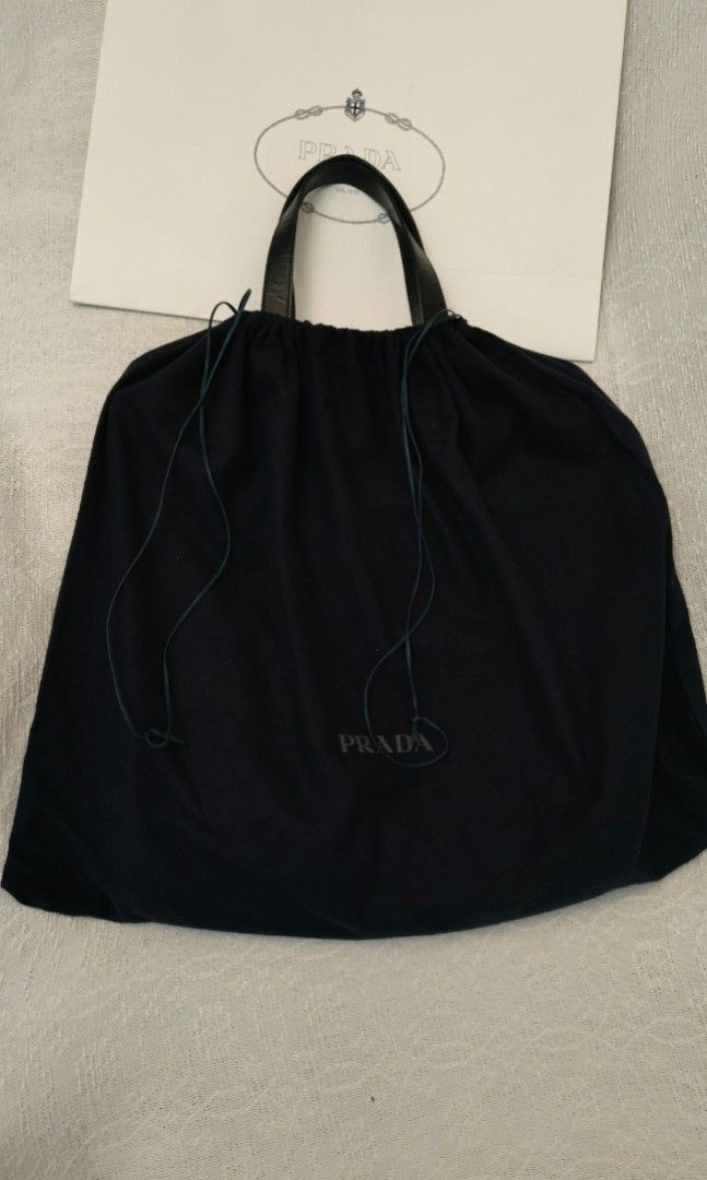 Prada Antic Soft Erica Tote Bag (Category: Luxury Bags & Wallets) located in Makati City. Submitted by emem.pre.owned.ph (Listing ID 1451863591, Image 1). Description: -Authentic Prada Antic Soft Erica Tote/Shoulder Bag -Premium leather handles and trim -Iconic Prada enamel triangle logo -Spacious main compartment with zip closure -Dual front zippered pockets for added organization -Detachable and adjustable shoulder strap -Lightweight, stylish, 