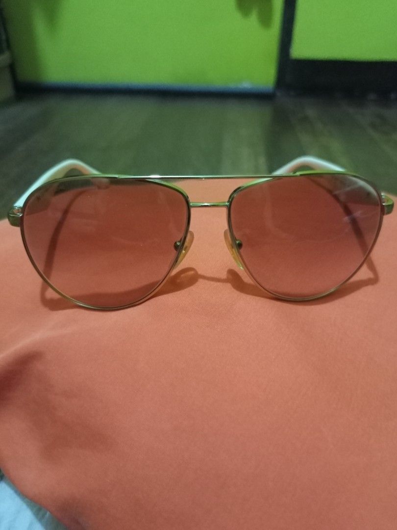 Prada Aviator Sunglasses Pink Lenses (Category: Sunglasses & Eyewear) located in Marikina City. Submitted by greyz.regginne_27 (Listing ID 1464570348, Image 2). Description: - Prada aviator sunglasses - Pink tinted lenses - White arms with gold accents - Made in Italy - Prada logo on the side - Ideal for sunny days.