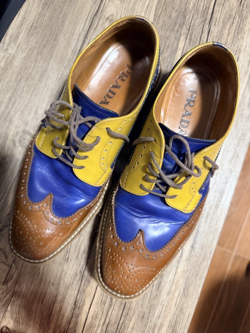 Prada Creepers Multi-Color Leather Brogues Espadrilles (Category: Casual Shoes) located in Manila. Submitted by impulsivebuyer1380 (Listing ID 1464766504, Image 2). Description: - Brand: Prada Creepers Size : 6.5 - Style: Multi-color leather wingtip brogues with espadrille jute midsole and grooved rubber sole - Colorway: Striking combination of blue, yellow, and brown - Details: Brown laces, tan leather interior lining, and stamped Prada branding