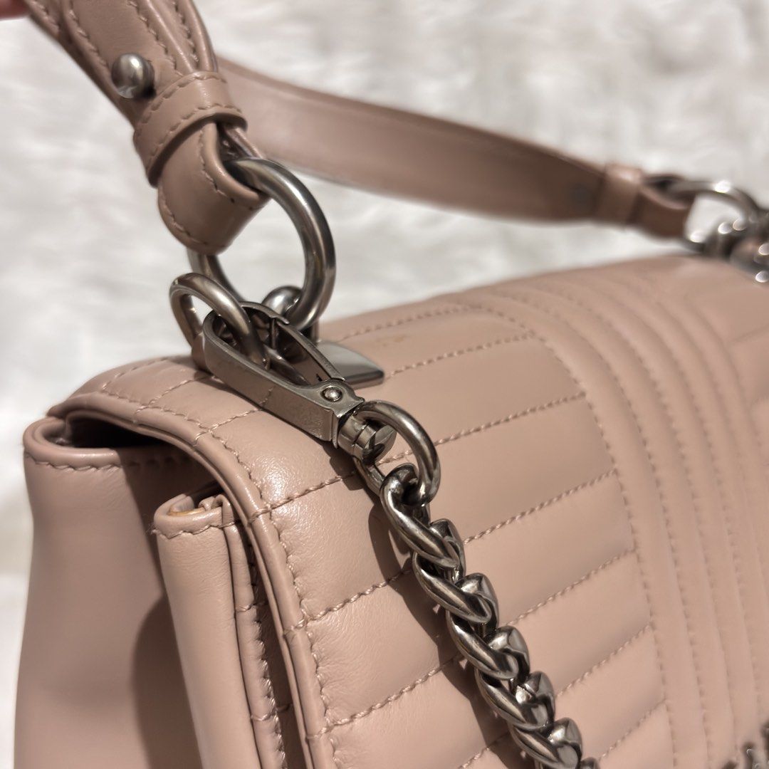 Prada Diagramme Medium Flap Shoulder Bag (Category: Other Accessories) located in Quezon City. Submitted by leens.preloved (Listing ID 1462682312, Image 3). Description: - Authentic Prada Bag - Color: Beige - Design: Quilted detailing - Strap: Chunky silver chain - Condition: Great, used only a few times - Size: Perfect for essentials.