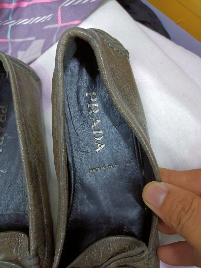 Prada Leather Loafers Made in Italy (Category: Loafers) located in Manila. Submitted by pnjdianne25879 (Listing ID 1464581184, Image 3). Description: - Authentic Prada Loafers - Made in Italy - Genuine Leather - Classic Slip-on Style - Small Bow Detail on Front - Comfortable and Stylish.