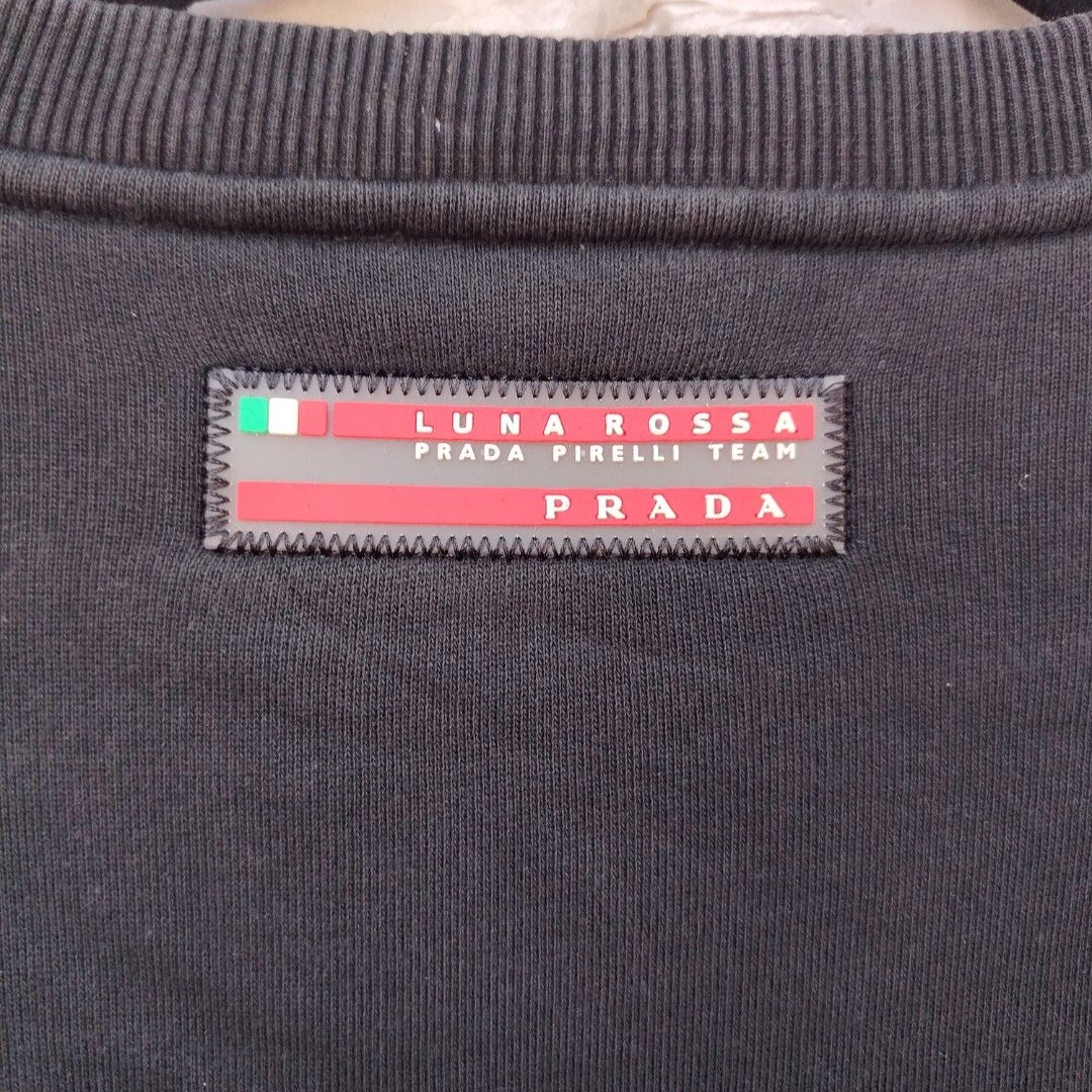 Prada Luna Rossa Pirelli Team Sweatshirt (Category: Coats, Jackets and Outerwear) located in Manila. Submitted by maetots (Listing ID 1464586787, Image 3). Description: - Authentic Prada sweatshirt - Size: XL - Features Luna Rossa Pirelli Team logo on chest pocket - Includes Prada Milano tag inside - Ideal for casual wear.
