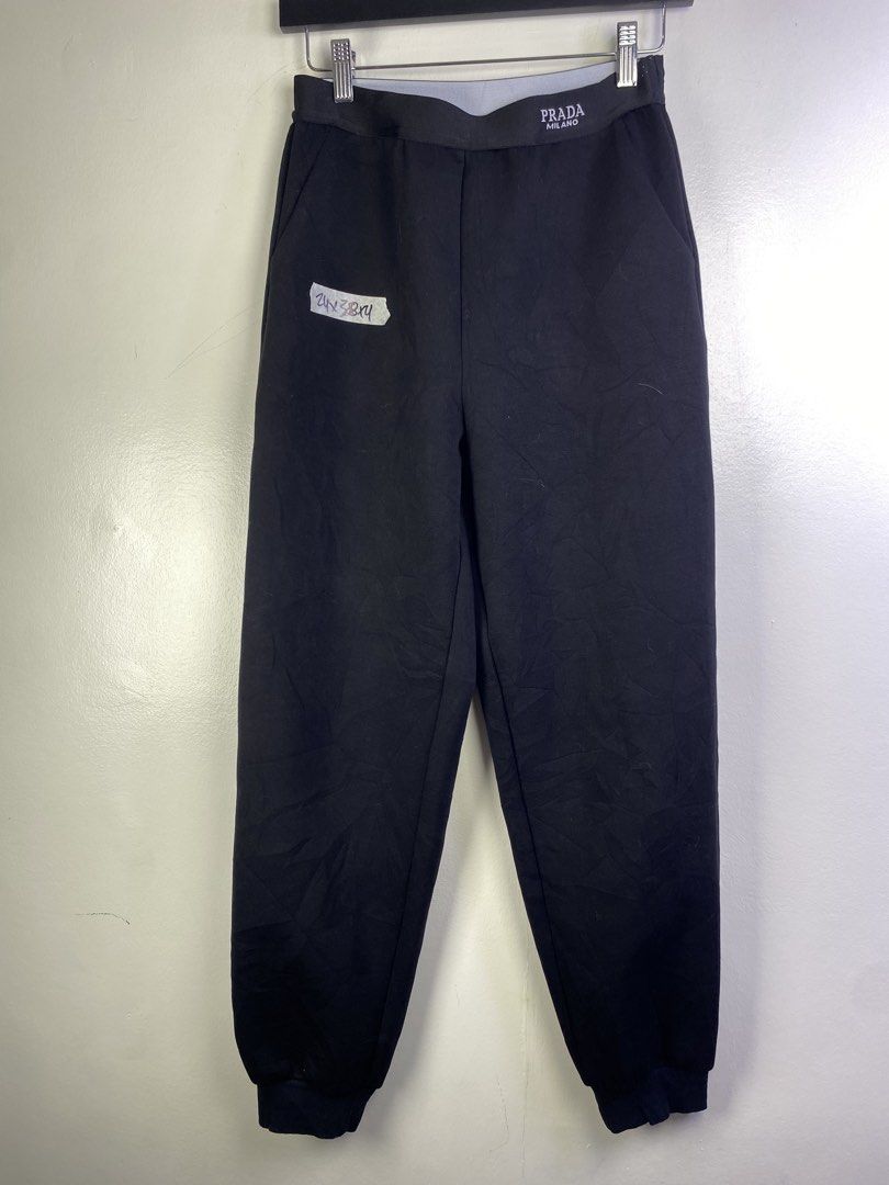 Prada Milano Black Jogger Pants (Category: Joggers) located in Manila. Submitted by declutterpromax (Listing ID 1464601126, Image 1). Description: - Prada Milano Jogger Pants - Color: Black - Size: M - Features elastic waistband with Prada Milano logo - Made in Italy - Perfect for comfortable and stylish casual wear.