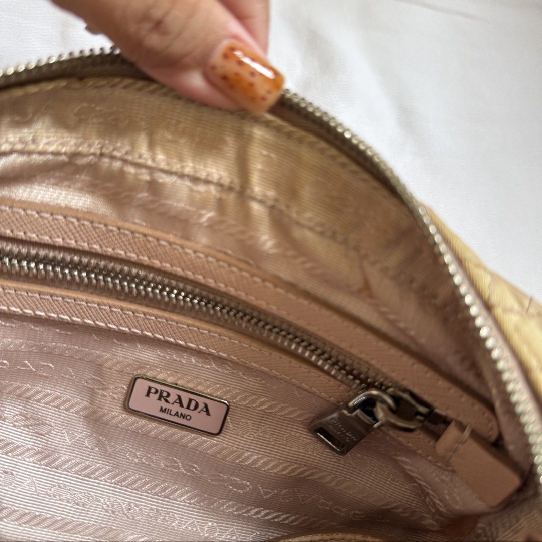 Prada Nylon Tessuto Quilted Crossbody Bag (Category: Luxury Bags & Wallets) located in Cebu City. Submitted by cdwears (Listing ID 1464596542, Image 2). Description: - Authentic Prada bag - With cards and dust bag (forgot to picture) - Vintage nude pink quilted nylon material - Used many times my go to bag - Silver hardware - Multiple interior compartments - Some signs of wear on exterior - Comes with a detachable leather strap (no chipping) - Id