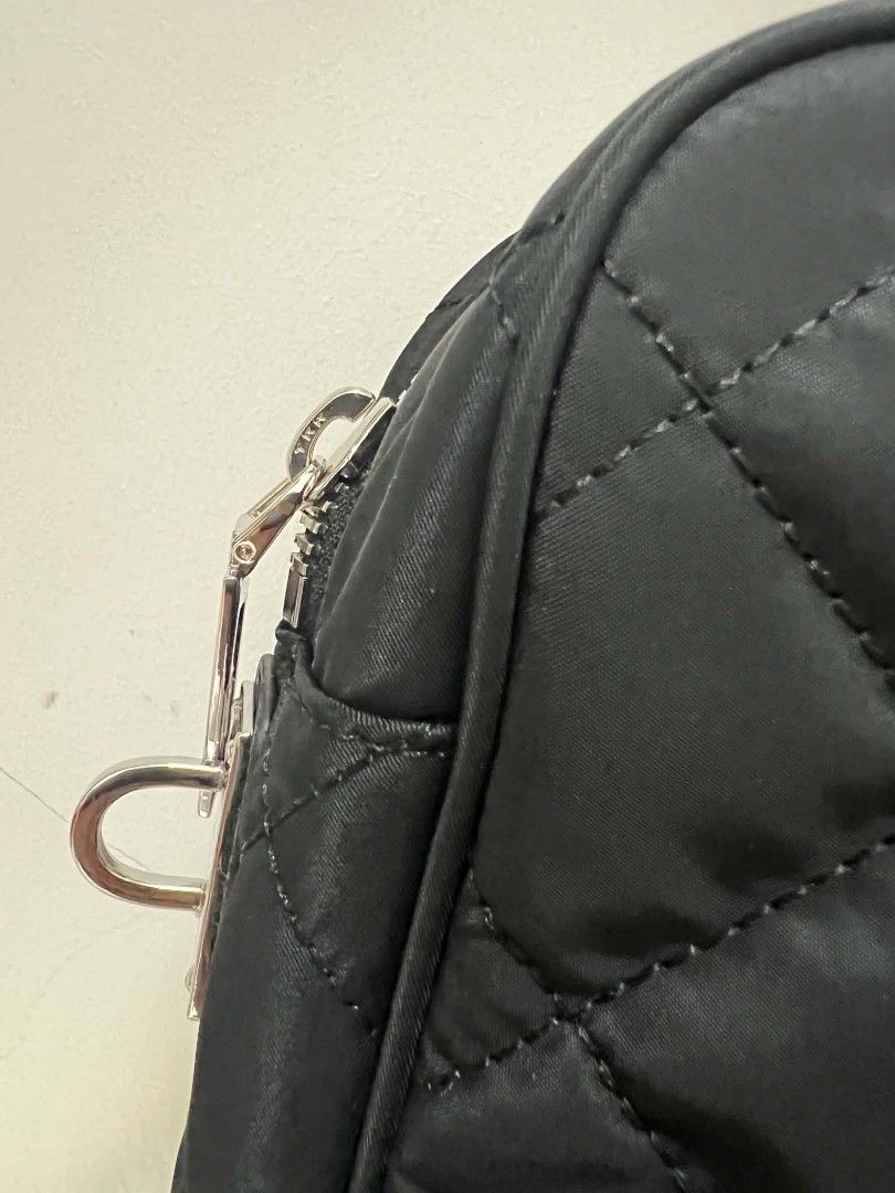 Prada Quilted Nylon Chain Shoulder Bag Black (Category: Luxury Bags & Wallets) located in Paoay. Submitted by rvf1230 (Listing ID 1464603102, Image 3). Description: - Authentic Black Prada Shoulder Bag - Quilted Nylon Material - Silver Chain Straps - Iconic Prada Triangle Logo - Includes Small Leather Tag Accessory - Versatile: Great for Everyday or Special Occasions - Condition: Clean and Well-Maintained.