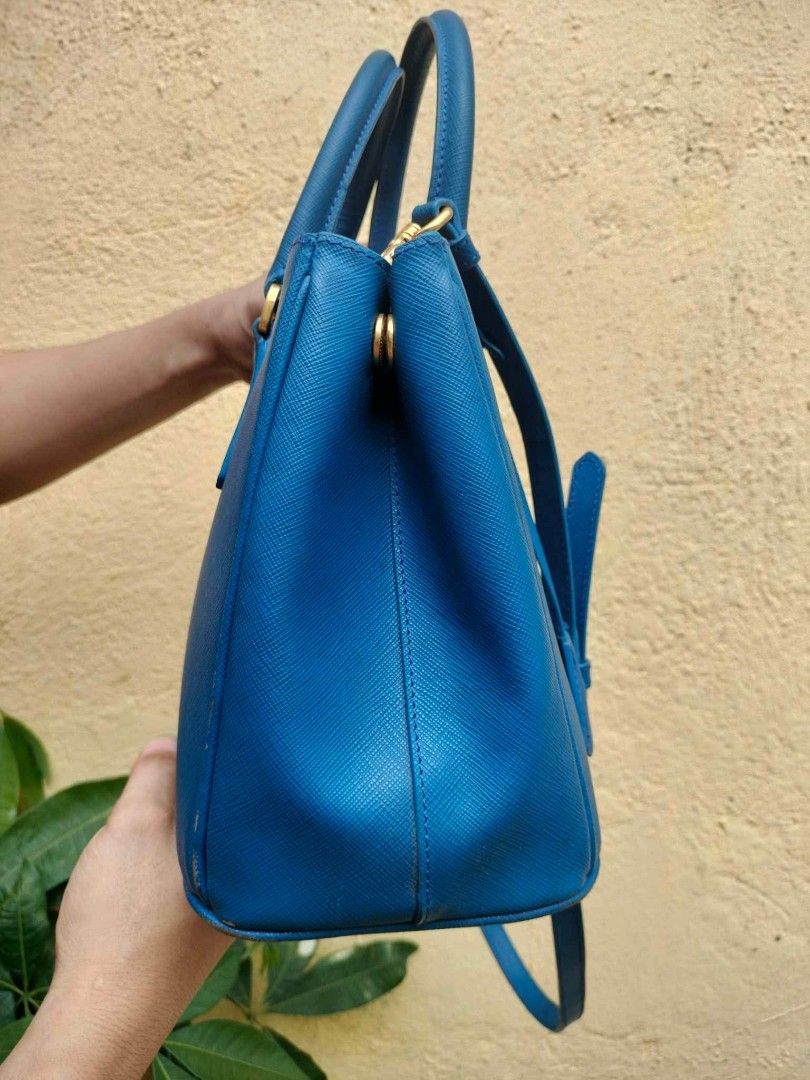 Prada Saffiano Lux Tote Bag Blue (Category: Luxury Bags & Wallets) located in Caloocan City. Submitted by tinshaoshop (Listing ID 1464634107, Image 3). Description: - Authentic Prada bag - Vibrant blue Saffiano leather - Gold hardware details - Top handles and detachable shoulder strap - Multiple interior compartments - Perfect for daily use or special occasions - with minor flaws - loc. Cabuyao Laguna.