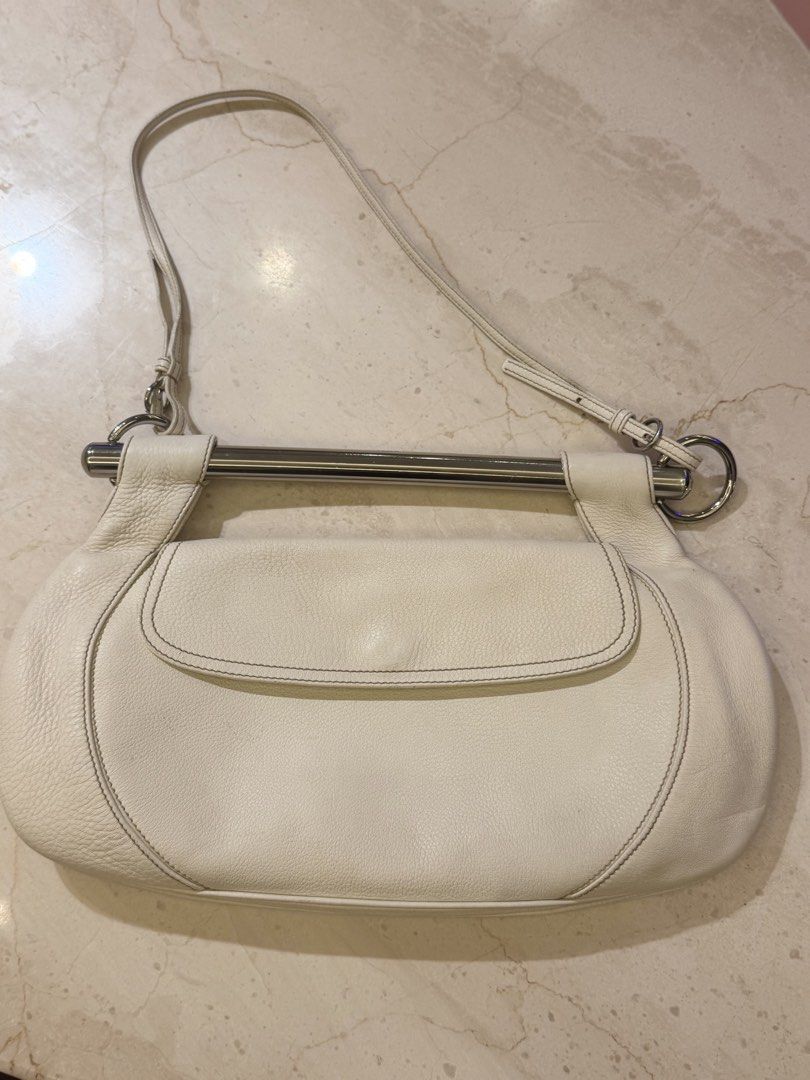 Prada Swing Vitello Daino 2-way bag (Category: Luxury Bags & Wallets) located in Quezon City. Submitted by loveangelmusicbaby (Listing ID 1464611764, Image 2). Description: - Authentic with Legit Grails certificate - Made in Italy - White pebbled leather - Contrast stitching - Sleek silver bar handle - Magnetic snap closure - Comes with original Prada dust bag.