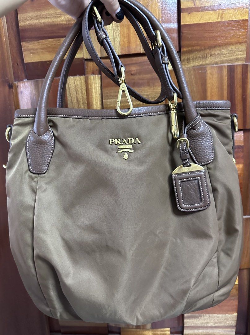 Prada Tessuto Vit. Dai Tote Bag Corinto (Category: Luxury Bags & Wallets) located in General Trias. Submitted by mimispreloves (Listing ID 1464604934, Image 1). Description: - Authentic Prada tote bag - Material: Tessuto and Vit. Dai leather - Color: Corinto - Includes authenticity card - Ideal for everyday use - Spacious interior - Features a shoulder strap.