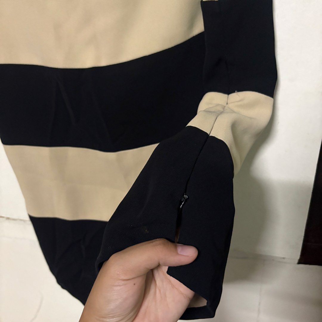 Preloved CELINE Striped Sleeveless Top Blouse (Category: Sleeveless) located in Manila. Submitted by zzajmr (Listing ID 1464666830, Image 3). Description: - Celine sleeveless top - Classic black and beige horizontal stripes - Convenient side zipper closure - Tagged size L - Versatile for casual outfits or layering can fit medium to large.