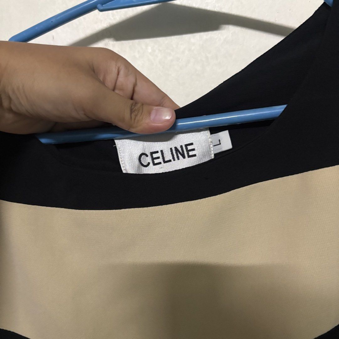 Preloved CELINE Striped Sleeveless Top Blouse (Category: Sleeveless) located in Manila. Submitted by zzajmr (Listing ID 1464666830, Image 2). Description: - Celine sleeveless top - Classic black and beige horizontal stripes - Convenient side zipper closure - Tagged size L - Versatile for casual outfits or layering can fit medium to large.
