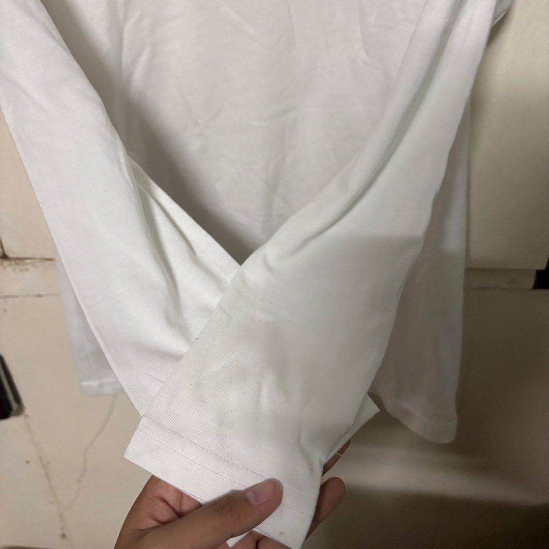 Preloved NT-Link White Long Sleeved Shirt (Category: Longsleeves) located in Manila. Submitted by zzajmr (Listing ID 1464664940, Image 3). Description: - Brand: NT-Link - Color: White - Style: Long-sleeved shirt - Size: S - Features: Simple, versatile, great for layering or wearing on its own. - Condition: Please check photos for details. best fit small to medium.