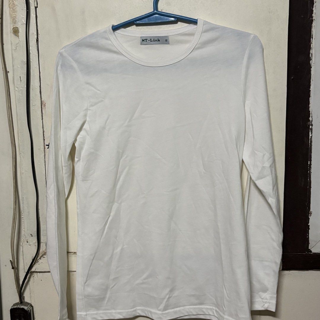 Preloved NT-Link White Long Sleeved Shirt (Category: Longsleeves) located in Manila. Submitted by zzajmr (Listing ID 1464664940, Image 1). Description: - Brand: NT-Link - Color: White - Style: Long-sleeved shirt - Size: S - Features: Simple, versatile, great for layering or wearing on its own. - Condition: Please check photos for details. best fit small to medium.