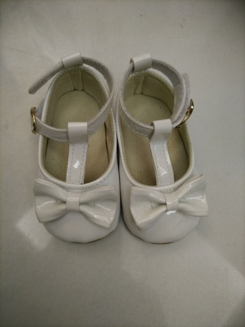 Preloved, take all (Category: Babies & Kids Fashion) located in Caloocan City. Submitted by yvette2030 (Listing ID 1464605523, Image 1). Description: Cute white patent leather baby shoes. T-strap design with a sweet bow on the front. Adjustable strap with buckle closure for a secure fit. Perfect for special occasions or everyday wear. Very clean and well-maintained..