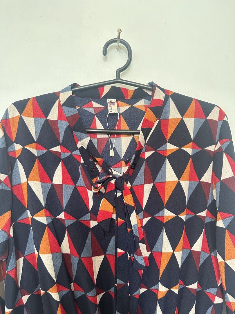 Printed (Geometric) Long-Sleeve Dress (Category: Dresses) located in Taguig. Submitted by closetbyenya (Listing ID 1464630968, Image 2). Description: ✨ Stylish geometric printed dress • Long sleeves with buttoned cuffs • V-neck with cute tie/bow detail • Elasticated waist for a flattering fit • Flowy skirt for a comfortable, feminine look • Colorful geometric print in navy, red, orange & cream • Dress length: 89 cm • Lightweight and easy to wear 
