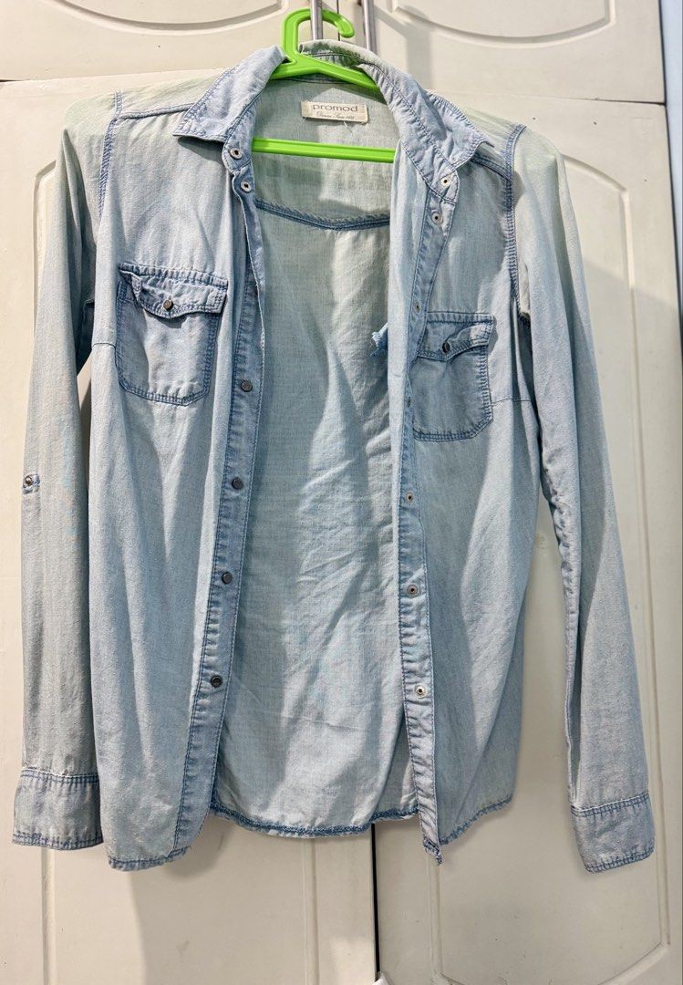 Promod Light Wash Denim Shirt (Category: Shirts) located in Manila. Submitted by melissaal82890 (Listing ID 1464586405, Image 1). Description: - Light wash denim shirt from Promod - Long sleeves with button cuffs - Two chest pockets with button closures - Button-up front - Versatile for layering or wearing on its ownd.