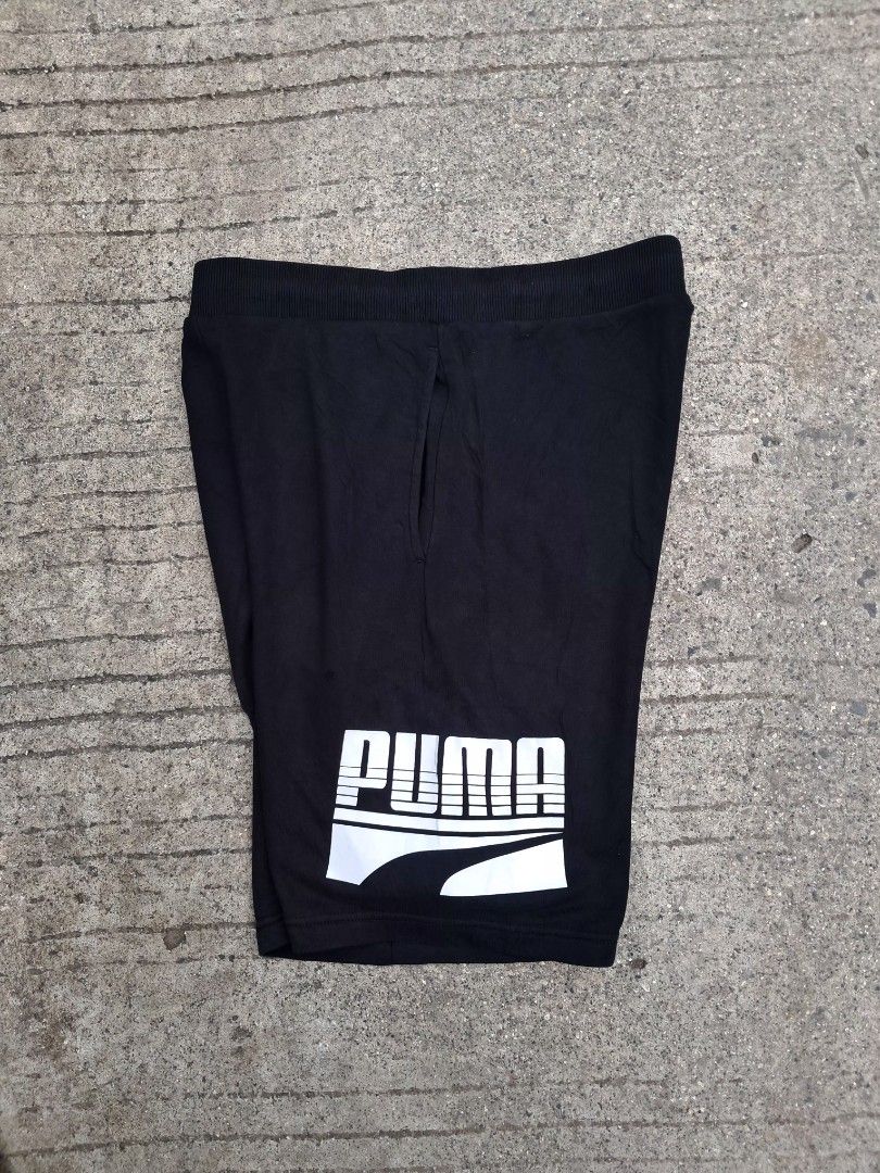 Puma Black Shorts with White Logo (Category: Shorts) located in Cebu City. Submitted by chill_zy (Listing ID 1464586460, Image 1). Description: - Black Puma shorts - Large white logo on left leg - Elastic waistband with drawstring - Two side pockets - Comfortable for lounging or workouts - Great for everyday wear.