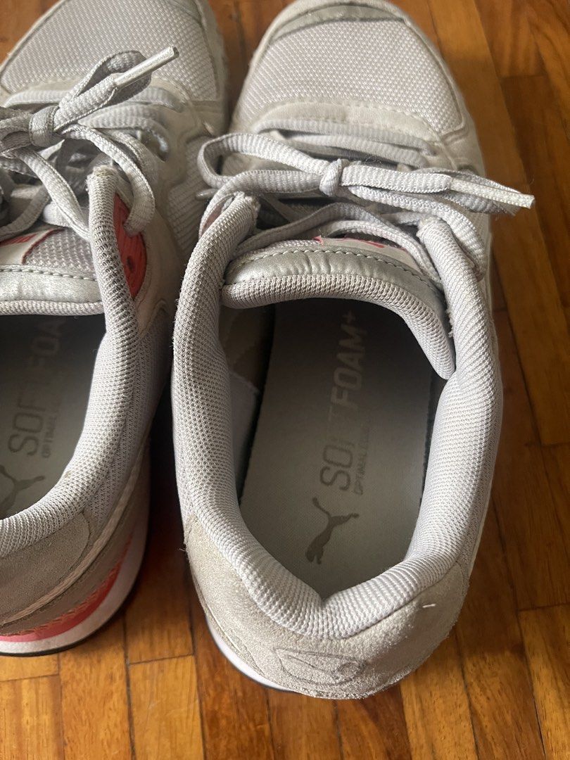 Puma Soft Foam Sneakers Grey Pink White (Category: Sneakers) located in San Juan City. Submitted by rike_ramirez (Listing ID 1464586695, Image 3). Description: US Size 6.5 Original, purchased in Japan. - light gray Puma sneakers - Pink and white accents - Puma branding on tongue and side - Soft Foam insoles for comfort - Lace-up closure - Ideal for casual wear or light exercise - Soles show some wear but retain good grip.